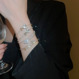 Close-up of sparkling multi-layer zircon square bracelets featuring geometric crystal charms