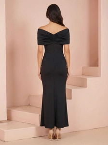 Detailed back view of a slim-fit black mermaid evening dress with off-shoulder ruffles