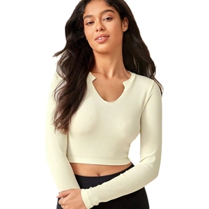 Beige ribbed knit yoga crop top with V-neckline and slim fit design for women