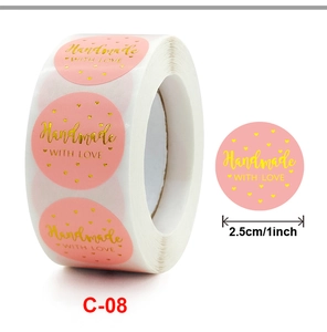 Detail of 1-inch pink round handmade with love stickers roll for gift packaging