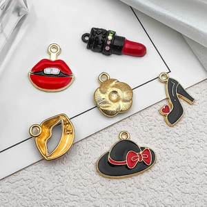 Detail of alloy charms featuring enamel lipstick and high heels with sparkling rhinestones