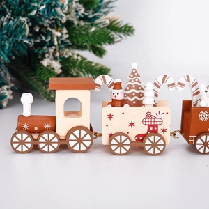 Detail of wooden Christmas train decor with festive snowman and miniature tree elements