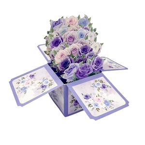 Detail of 3D pop-up purple paper roses in a gift box with intricate laser-cut craftsmanship