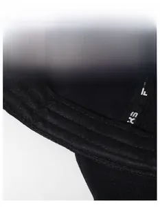 Detail shot of the widened sweatband and interior stitching on a black baseball cap