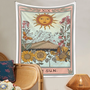 Detailed Bohemian tapestry showing the sun tarot card pattern with vibrant sunflowers