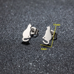 Macro shot showing dimensions of minimalist stainless steel cat earrings in silver