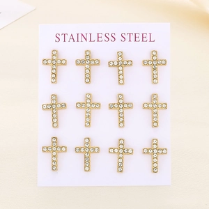 Set of twelve gold stainless steel cross earrings with inlaid crystals on white display card