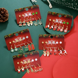 Detailed set of Christmas stud earrings featuring snowflakes, reindeer, and festive trees