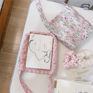 Detailed top view of pink floral heart tote bags with matching scrunchies and hair clip