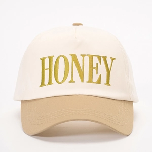 Two-tone baseball cap in cream and khaki with yellow HONEY 3D letter embroidery