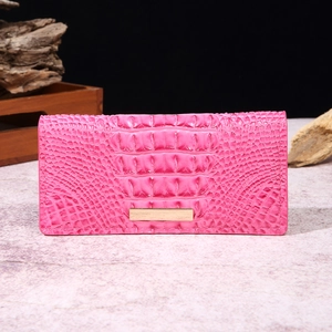Detail of rose pink crocodile pattern long wallet with elegant gold metal hardware