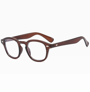 Detail view of amber brown round glasses frames with classic silver diamond rivet accents