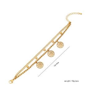 Detailed close-up of double-layer gold star bracelet with pearl accents, 16+4cm length
