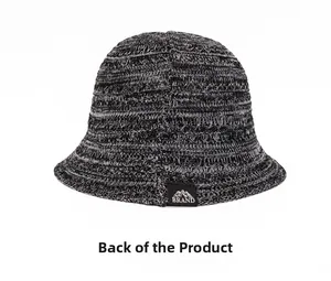 Detail view of the back of a breathable knitted bucket hat with a mountain patch logo