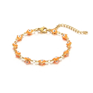 Detail of gold evil eye bracelet featuring orange enamel charms and adjustable lobster clasp