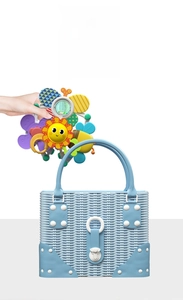 Detail of multi-purpose stroller bell with cartoon sun, flowers and colorful spinning beads