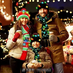 Close-up of LED Christmas knit hat and scarf set with reindeer and snowflake patterns