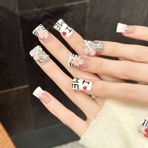 Pink cherry press-on nails with 3D floral accents and diamond heart charms