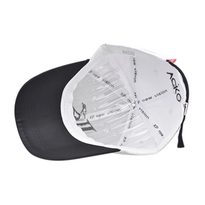 Detail view of cotton baseball cap interior showing stitching and 100% cotton label
