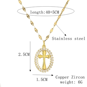 Detail of gold cross pendant with cubic zirconia inlay and 40+5cm stainless steel chain