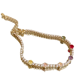 Elegant gold-plated bracelet with colorful faceted zircons and adjustable lobster clasp