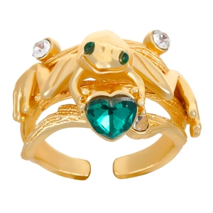 Detail of adjustable gold frog ring featuring a green heart stone and gem-set eyes