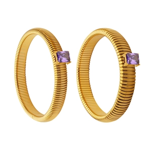 Golden textured hoop earrings with square purple zircon stone inlay in 45-degree view