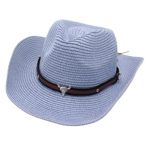 Western straw cowboy hat in lavender with a faux leather band and silver bull skull charm