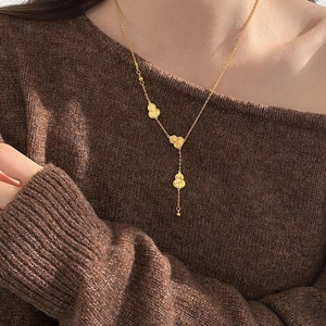 18k gold plated gourd pendant necklace worn on a brown sweater for a daily chic look