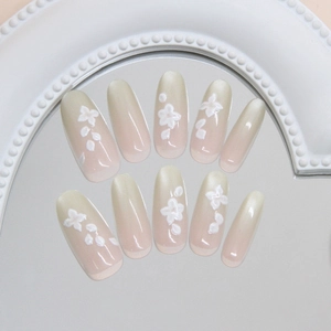 Handmade gradient oval press-on nails with white 3D floral accents and pearl details