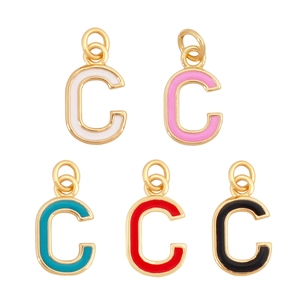 Macro view of C-shaped enamel charms with gold-toned metal borders in five bright colors