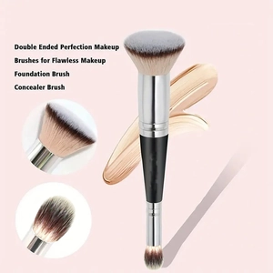 Detail of dual-ended makeup brush with foundation flat head and concealer brush bristles