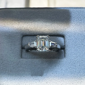 2ct emerald cut moissanite ring in S925 sterling silver presented in a grey jewelry box