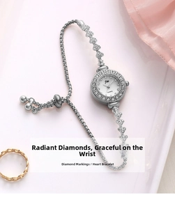 Detail of silver quartz watch featuring heart-shaped links and zircon-inlaid round bezel