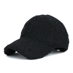 Close-up of fluffy black teddy fleece baseball cap showing warm textured lamb wool fabric