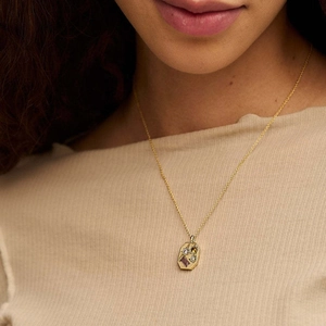 U-shaped kaleidoscope lucky symbol necklace with cubic zirconia and gold plating