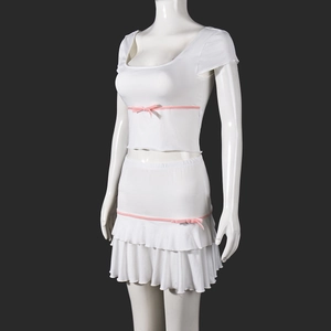 Detail of white cropped top and tiered ruffle skirt set with pink ribbon bows