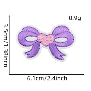 Detailed size view of a purple bow embroidery patch with a pink heart and white border