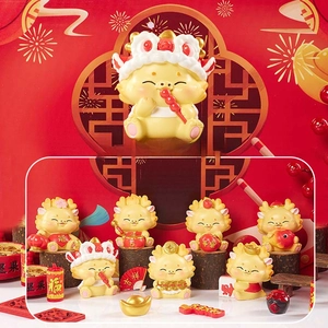 Detail of Chinese Tang-style dragon figurines in lucky yellow and red festive theme