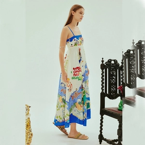 Women's white sleeveless maxi dress with blue trim and graffiti print on high-quality linen
