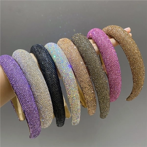 Detail showing various colors of luxury padded headbands with sparkling rhinestones