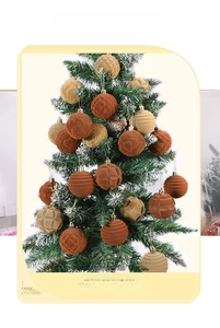 Close-up of velvet flocked Christmas balls with heart and diamond textures on tree
