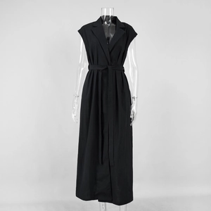 Detail of black sleeveless dress with classic lapel collar and waist tie belt