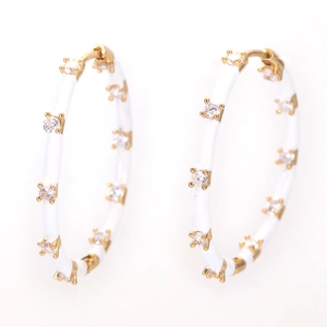 Exaggerated gold hoop earrings with white enamel coating and clear zircon stones inlay