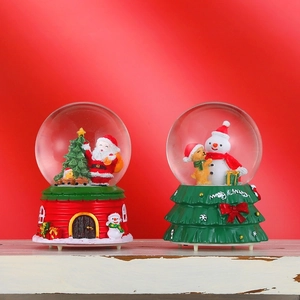 Christmas crystal snow globes with Santa and Snowman figures on red holiday background