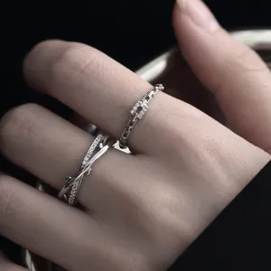 Minimalist silver crisscross twig ring and geometric chain ring set with sparkling zircons