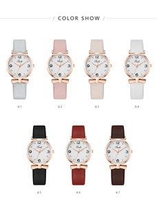 Detail showing a colorful collection of women's quartz watches with bow leather straps