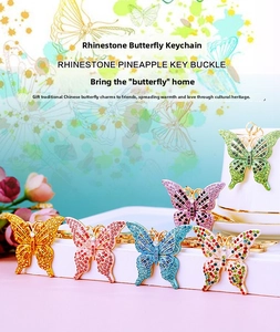 Macro display of crystal-encrusted butterfly keychains in various vibrant color schemes