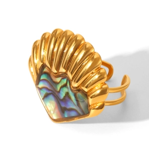 Detailed close-up of golden shell-shaped open ring with colorful abalone inlay