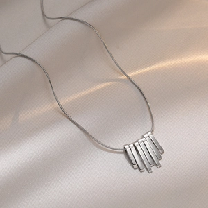 Minimalist silver bar necklace with geometric pendants on sleek snake bone chain